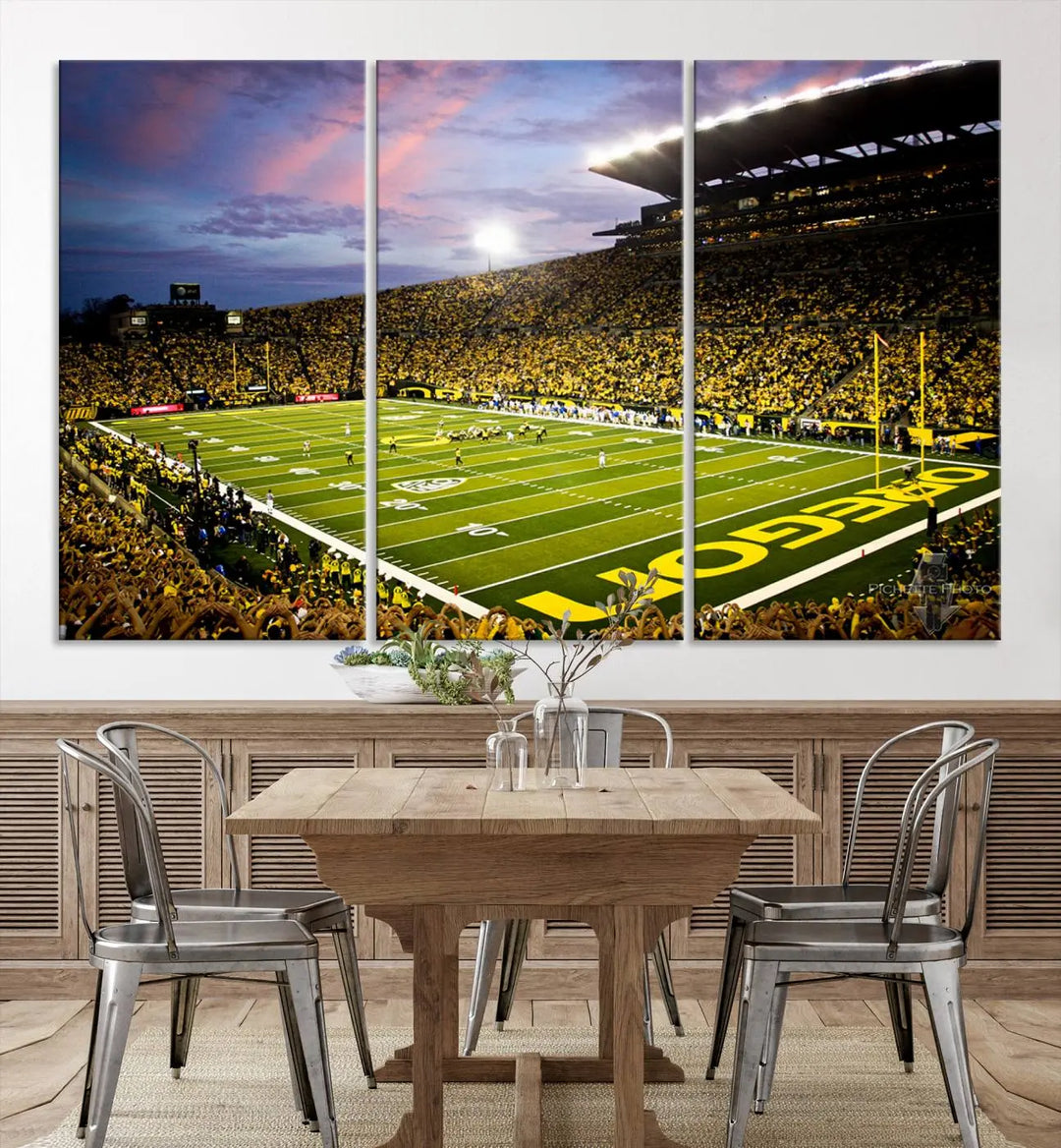 The living room showcases a triptych titled "University of Oregon Ducks Football Team Print - Eugene Autzen Stadium Wall Art Canvas Print," exhibiting a football stadium at sunset with a premium gallery-quality finish.