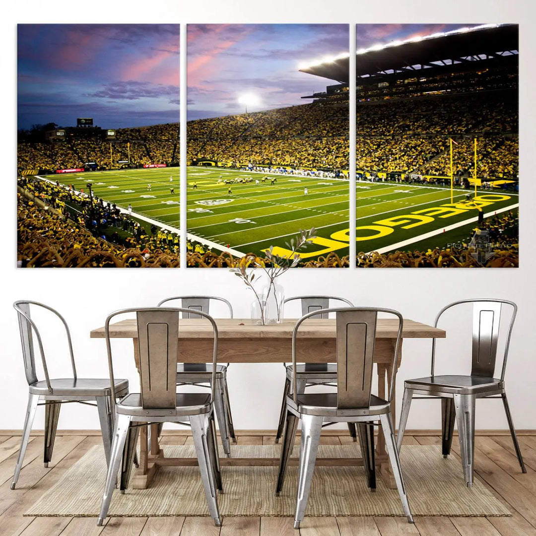 The living room showcases a triptych titled "University of Oregon Ducks Football Team Print - Eugene Autzen Stadium Wall Art Canvas Print," exhibiting a football stadium at sunset with a premium gallery-quality finish.