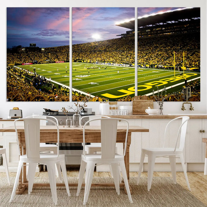 The living room showcases a triptych titled "University of Oregon Ducks Football Team Print - Eugene Autzen Stadium Wall Art Canvas Print," exhibiting a football stadium at sunset with a premium gallery-quality finish.