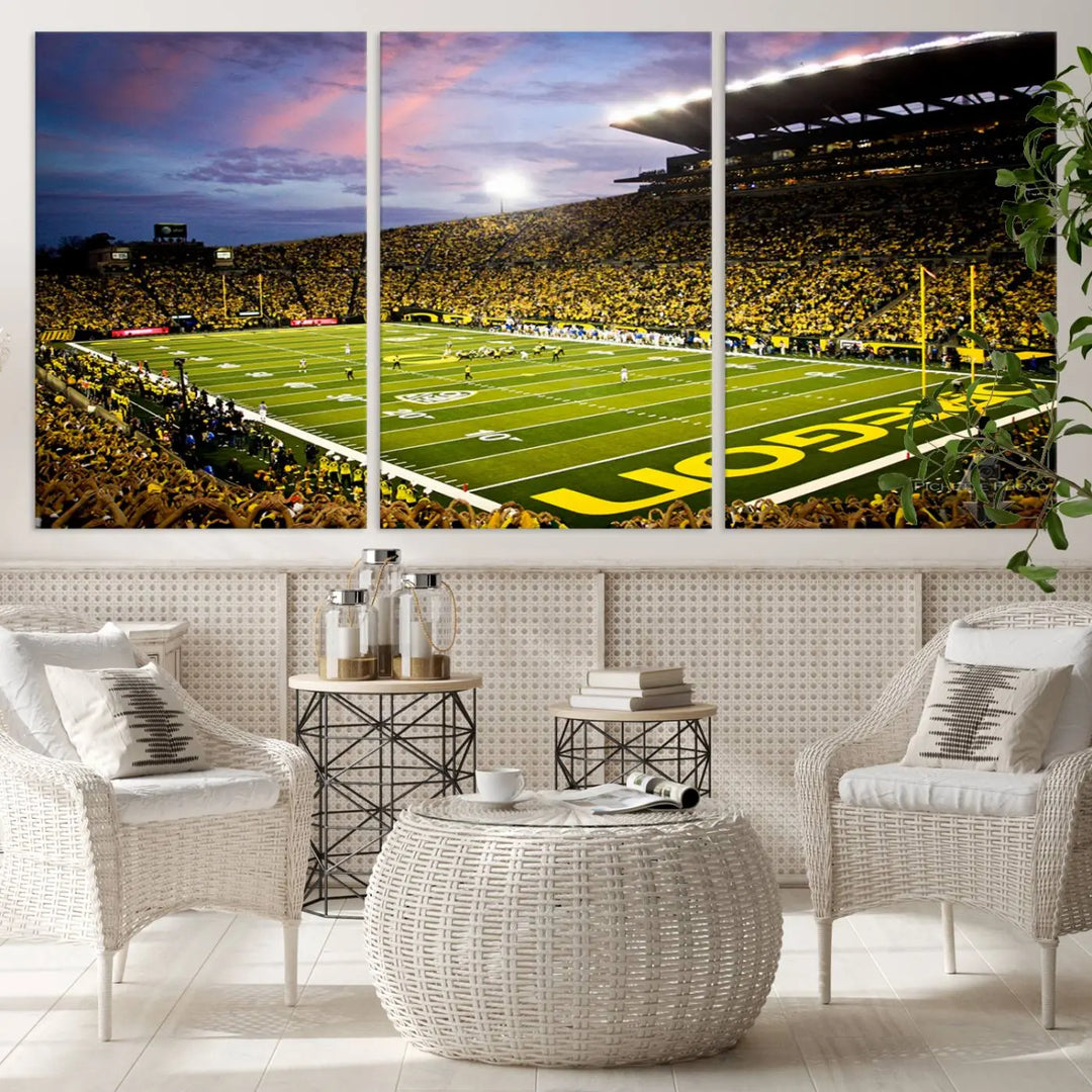 The living room showcases a triptych titled "University of Oregon Ducks Football Team Print - Eugene Autzen Stadium Wall Art Canvas Print," exhibiting a football stadium at sunset with a premium gallery-quality finish.