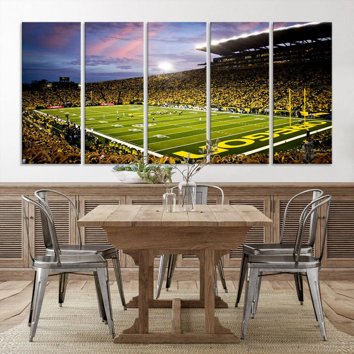 The living room showcases a triptych titled "University of Oregon Ducks Football Team Print - Eugene Autzen Stadium Wall Art Canvas Print," exhibiting a football stadium at sunset with a premium gallery-quality finish.