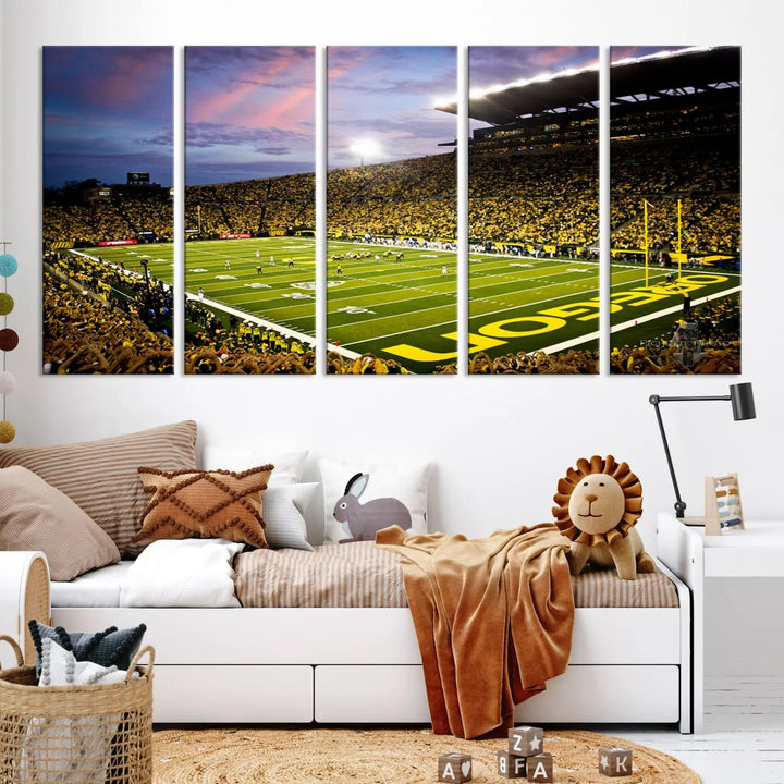 The living room showcases a triptych titled "University of Oregon Ducks Football Team Print - Eugene Autzen Stadium Wall Art Canvas Print," exhibiting a football stadium at sunset with a premium gallery-quality finish.