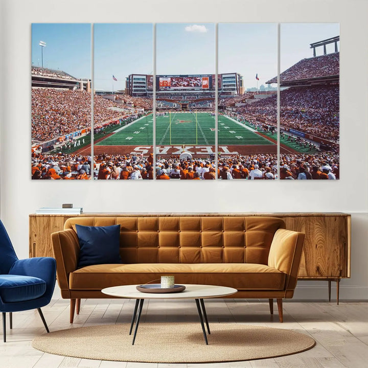 A University of Texas Longhorns Football Team Print, depicting the bustling Darrell K Royal-Texas Memorial Stadium at Campbell-Williams Field, is mounted in a modern living room.