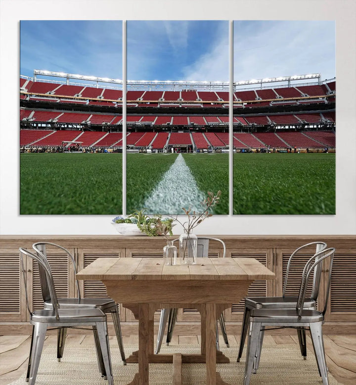 In the dining room, a University of Tulsa Golden Hurricane Football Team Print - Tulsa H.A. Chapman Stadium wall art canvas print is prominently displayed as a large triptych, enhanced by soft lighting.