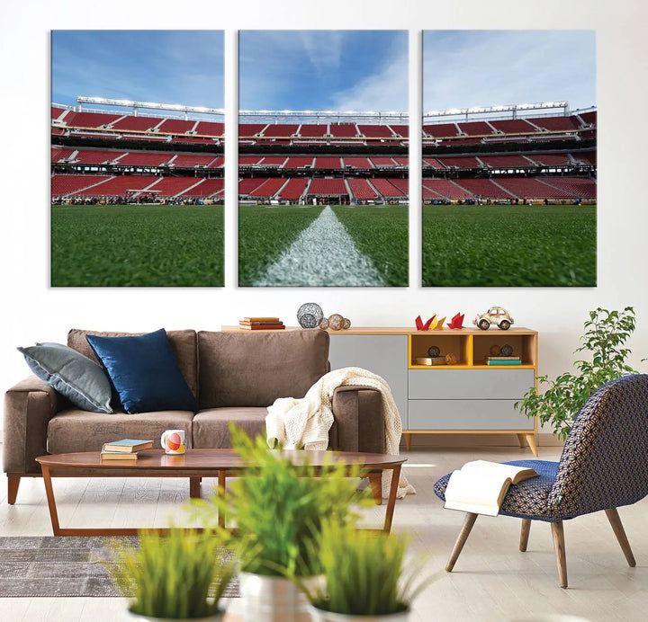 In the dining room, a University of Tulsa Golden Hurricane Football Team Print - Tulsa H.A. Chapman Stadium wall art canvas print is prominently displayed as a large triptych, enhanced by soft lighting.