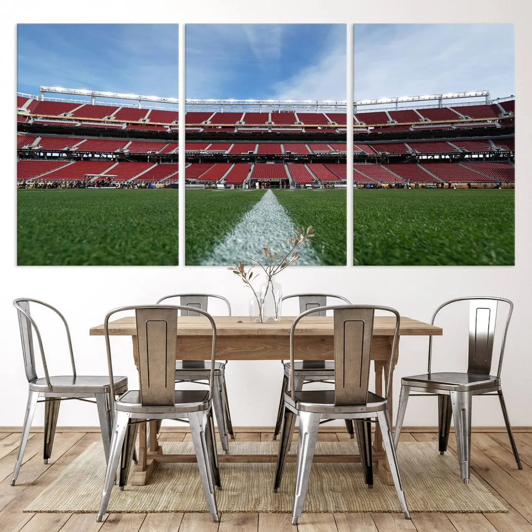 In the dining room, a University of Tulsa Golden Hurricane Football Team Print - Tulsa H.A. Chapman Stadium wall art canvas print is prominently displayed as a large triptych, enhanced by soft lighting.