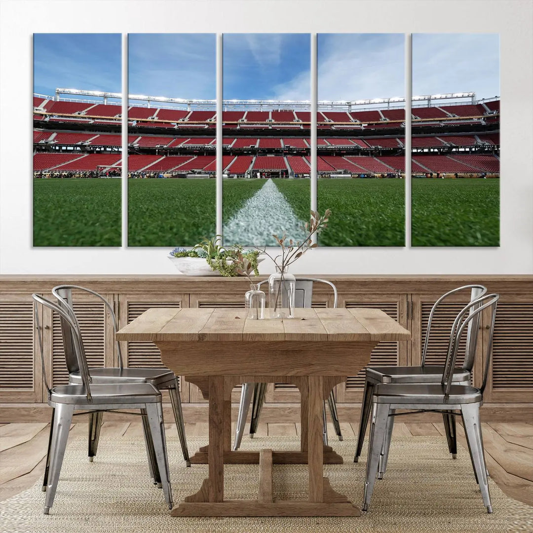 In the dining room, a University of Tulsa Golden Hurricane Football Team Print - Tulsa H.A. Chapman Stadium wall art canvas print is prominently displayed as a large triptych, enhanced by soft lighting.