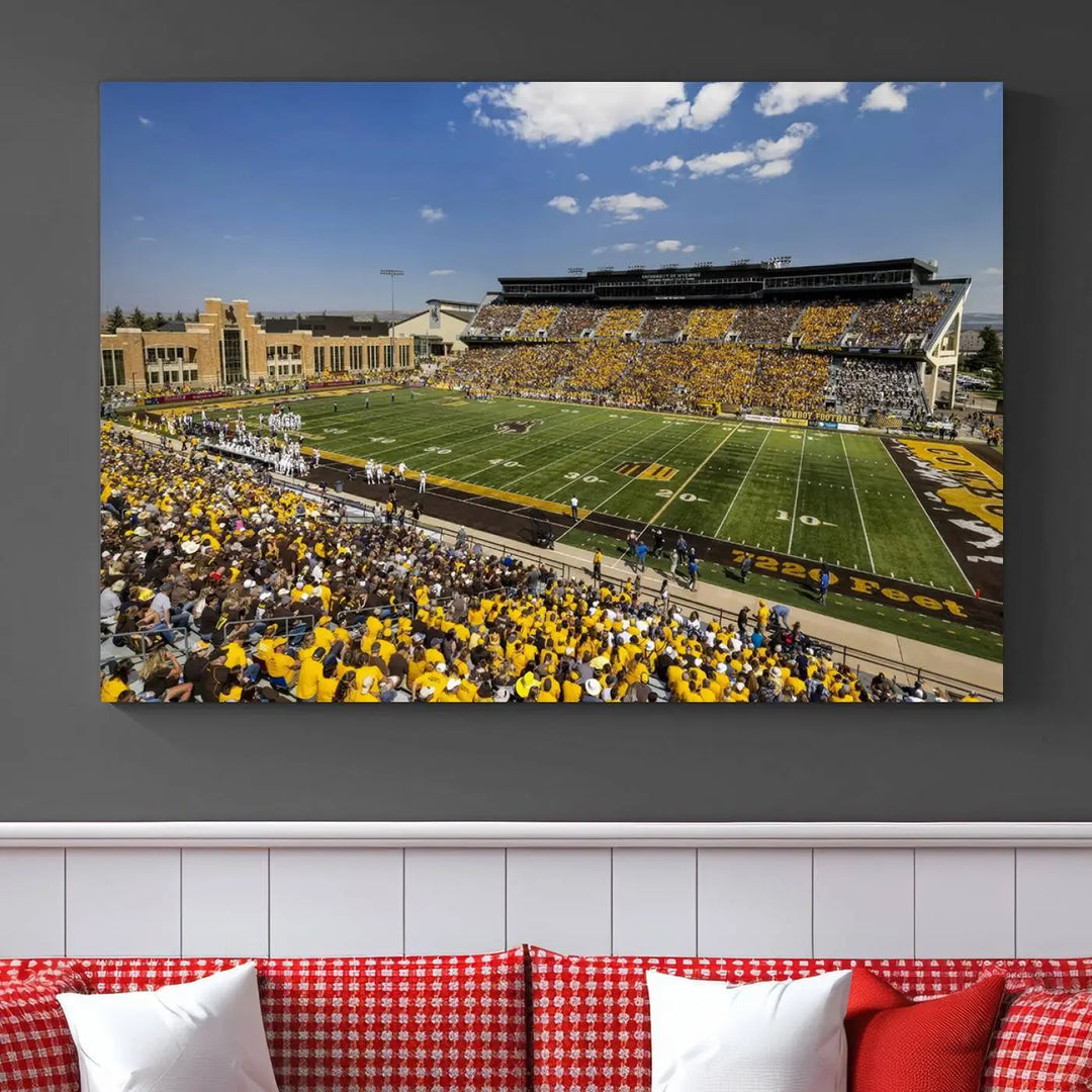 A University of Wyoming Cowboys Football Team print, featuring Laramie Jonah Field at War Memorial Stadium on a premium canvas, is displayed in the room.