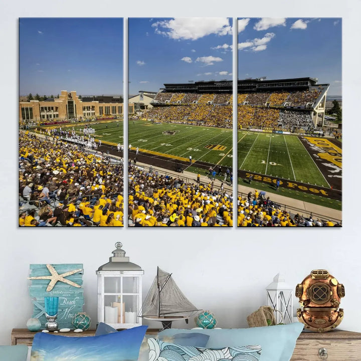 A University of Wyoming Cowboys Football Team print, featuring Laramie Jonah Field at War Memorial Stadium on a premium canvas, is displayed in the room.