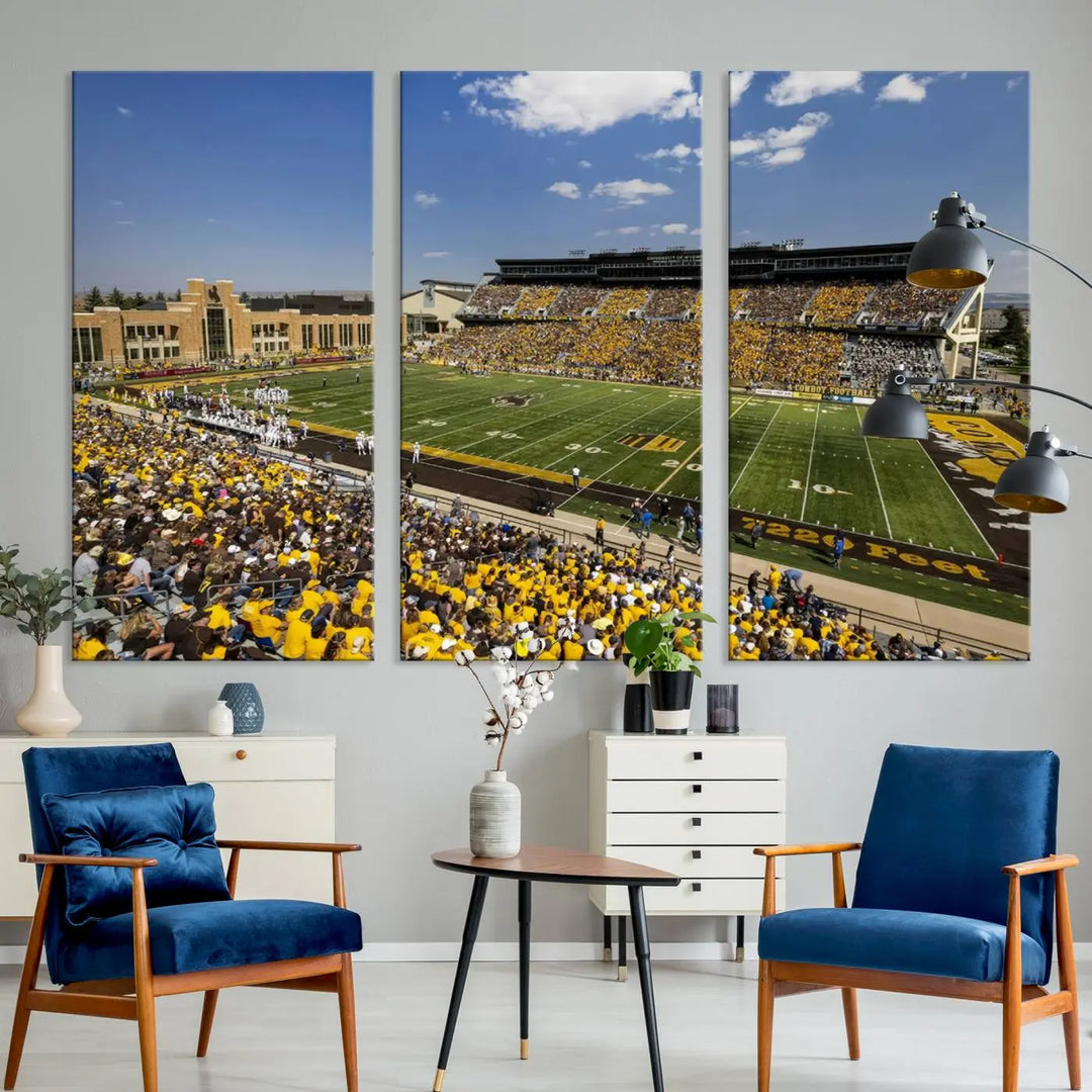 A University of Wyoming Cowboys Football Team print, featuring Laramie Jonah Field at War Memorial Stadium on a premium canvas, is displayed in the room.