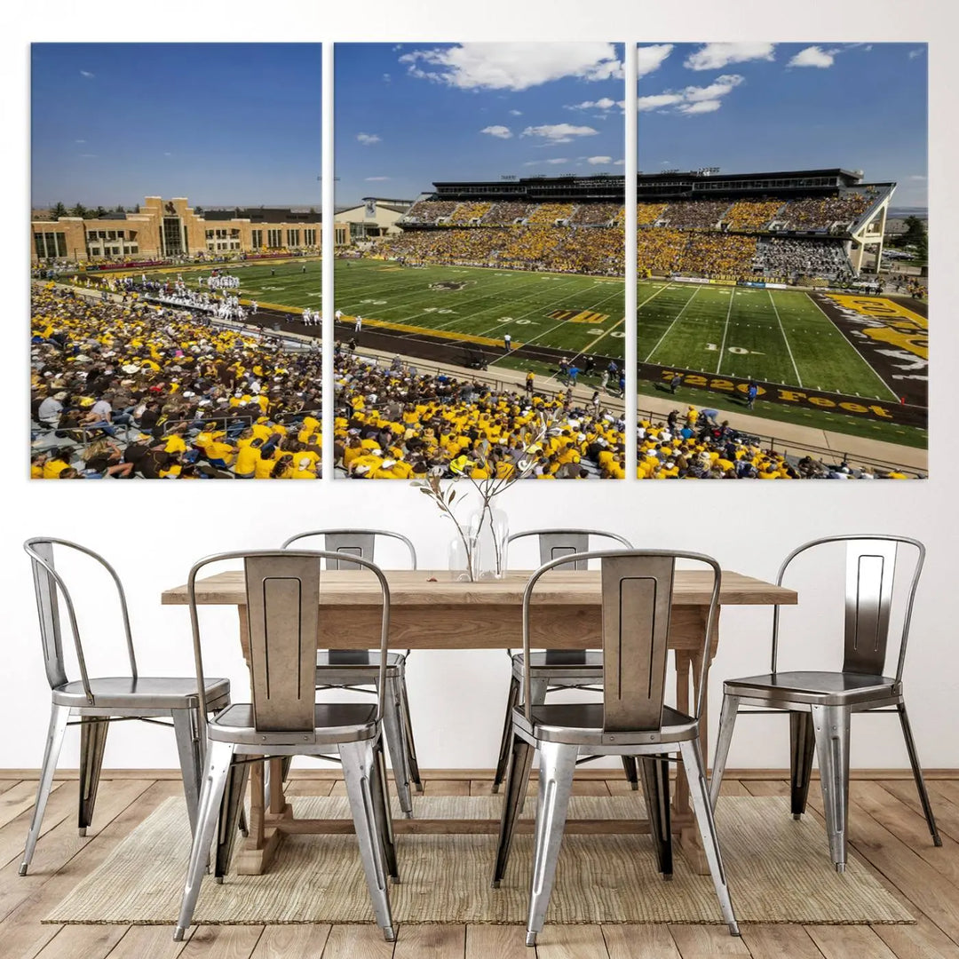 A University of Wyoming Cowboys Football Team print, featuring Laramie Jonah Field at War Memorial Stadium on a premium canvas, is displayed in the room.