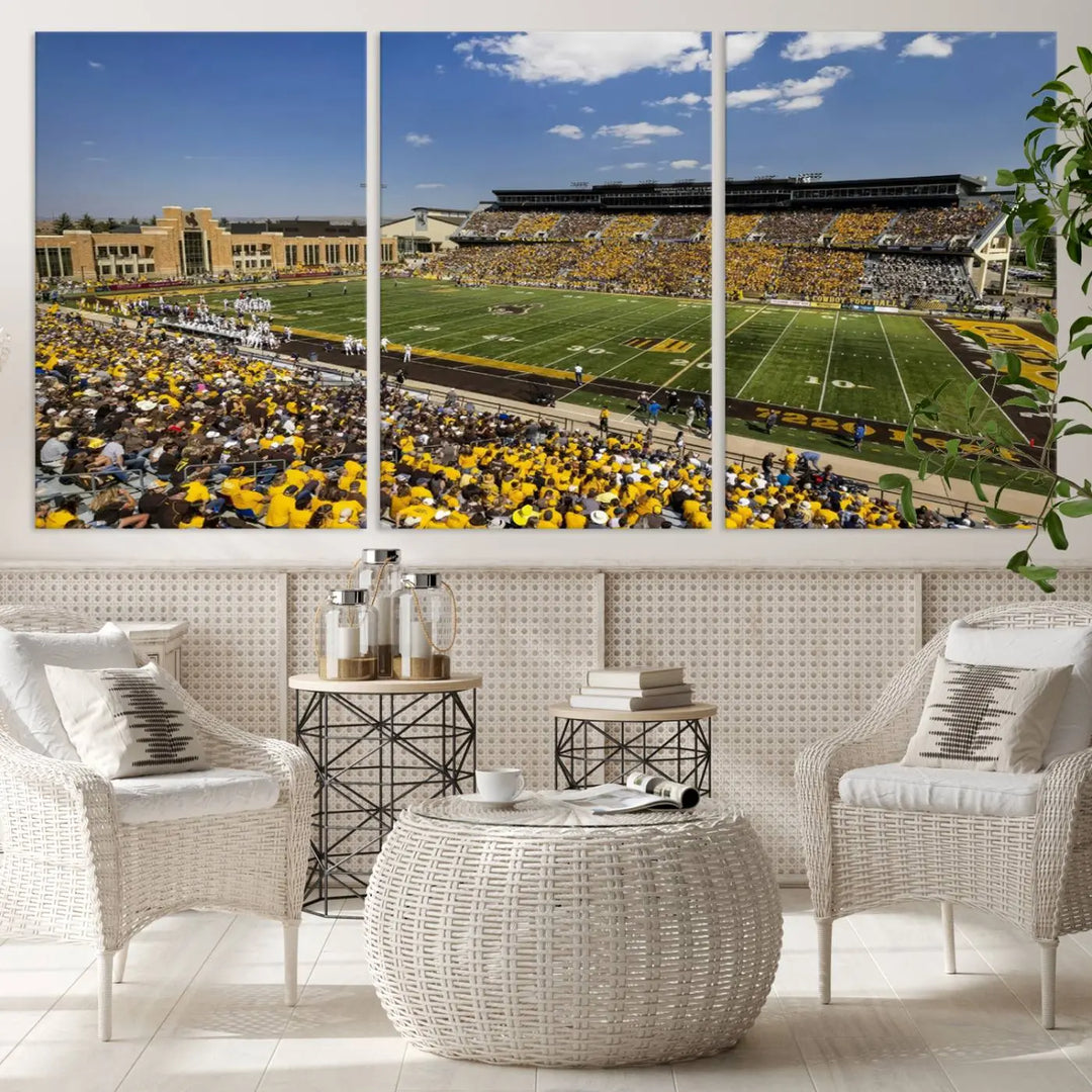 A University of Wyoming Cowboys Football Team print, featuring Laramie Jonah Field at War Memorial Stadium on a premium canvas, is displayed in the room.