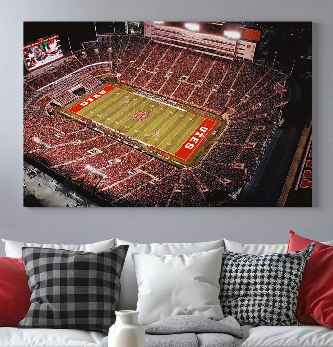 The modern living room is adorned with a Utah Utes Football Team Print - Salt Lake City Rice-Eccles Stadium Wall Art Canvas Print, depicting a packed football stadium.