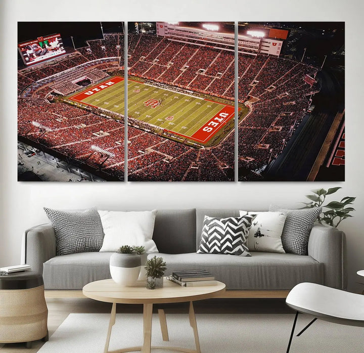 The modern living room is adorned with a Utah Utes Football Team Print - Salt Lake City Rice-Eccles Stadium Wall Art Canvas Print, depicting a packed football stadium.