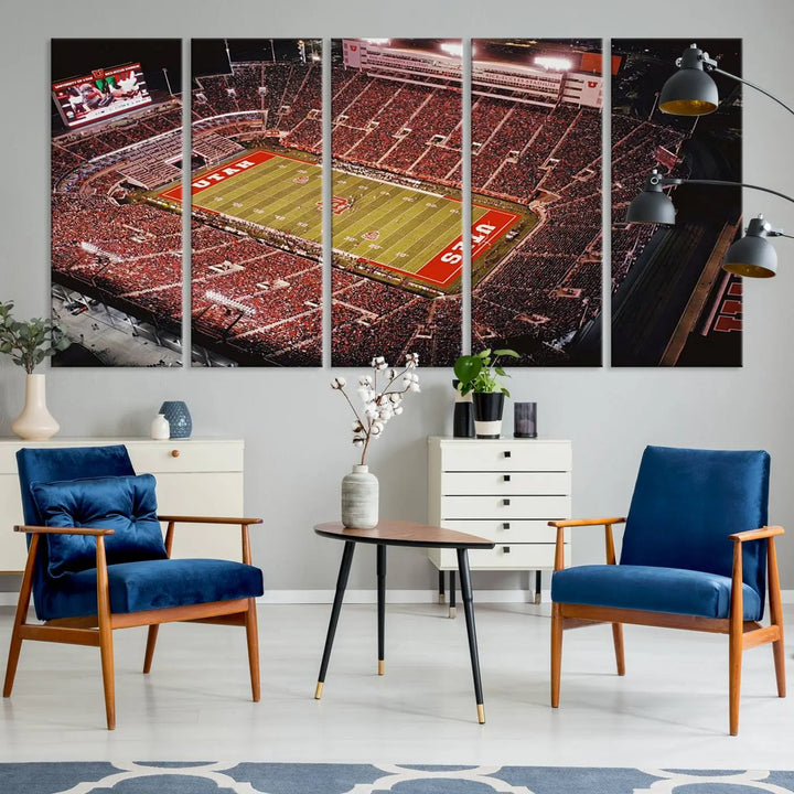 The modern living room is adorned with a Utah Utes Football Team Print - Salt Lake City Rice-Eccles Stadium Wall Art Canvas Print, depicting a packed football stadium.