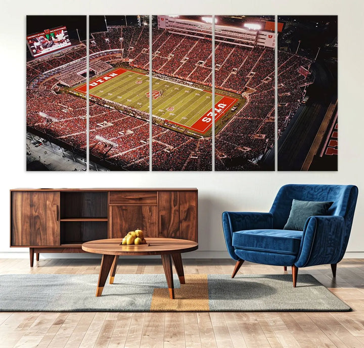 The modern living room is adorned with a Utah Utes Football Team Print - Salt Lake City Rice-Eccles Stadium Wall Art Canvas Print, depicting a packed football stadium.