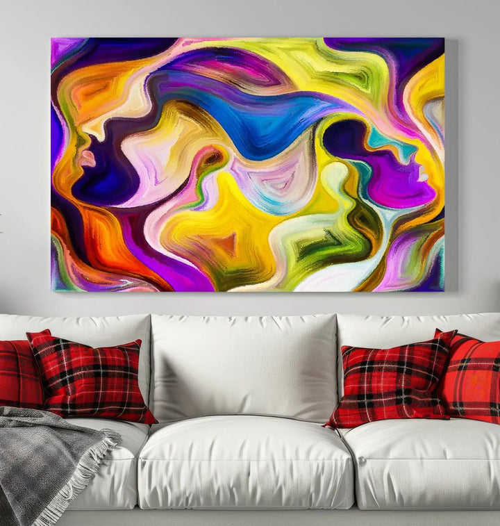 The wall above features the Vibrant Colors Human Figures Wall Art Canvas Print. Each piece showcases abstract multicolored face silhouettes on museum-quality canvas, enhancing both its vibrancy and longevity.