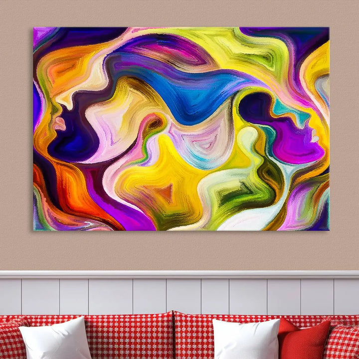 The wall above features the Vibrant Colors Human Figures Wall Art Canvas Print. Each piece showcases abstract multicolored face silhouettes on museum-quality canvas, enhancing both its vibrancy and longevity.