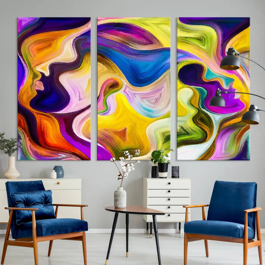 The wall above features the Vibrant Colors Human Figures Wall Art Canvas Print. Each piece showcases abstract multicolored face silhouettes on museum-quality canvas, enhancing both its vibrancy and longevity.