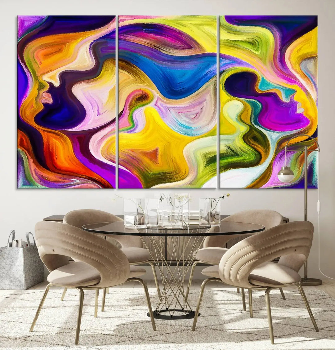 The wall above features the Vibrant Colors Human Figures Wall Art Canvas Print. Each piece showcases abstract multicolored face silhouettes on museum-quality canvas, enhancing both its vibrancy and longevity.