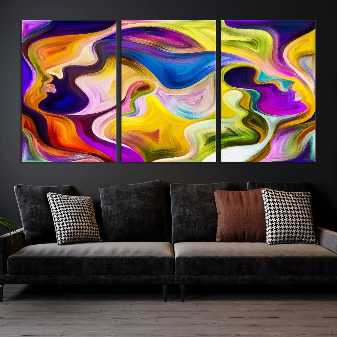 The wall above features the Vibrant Colors Human Figures Wall Art Canvas Print. Each piece showcases abstract multicolored face silhouettes on museum-quality canvas, enhancing both its vibrancy and longevity.