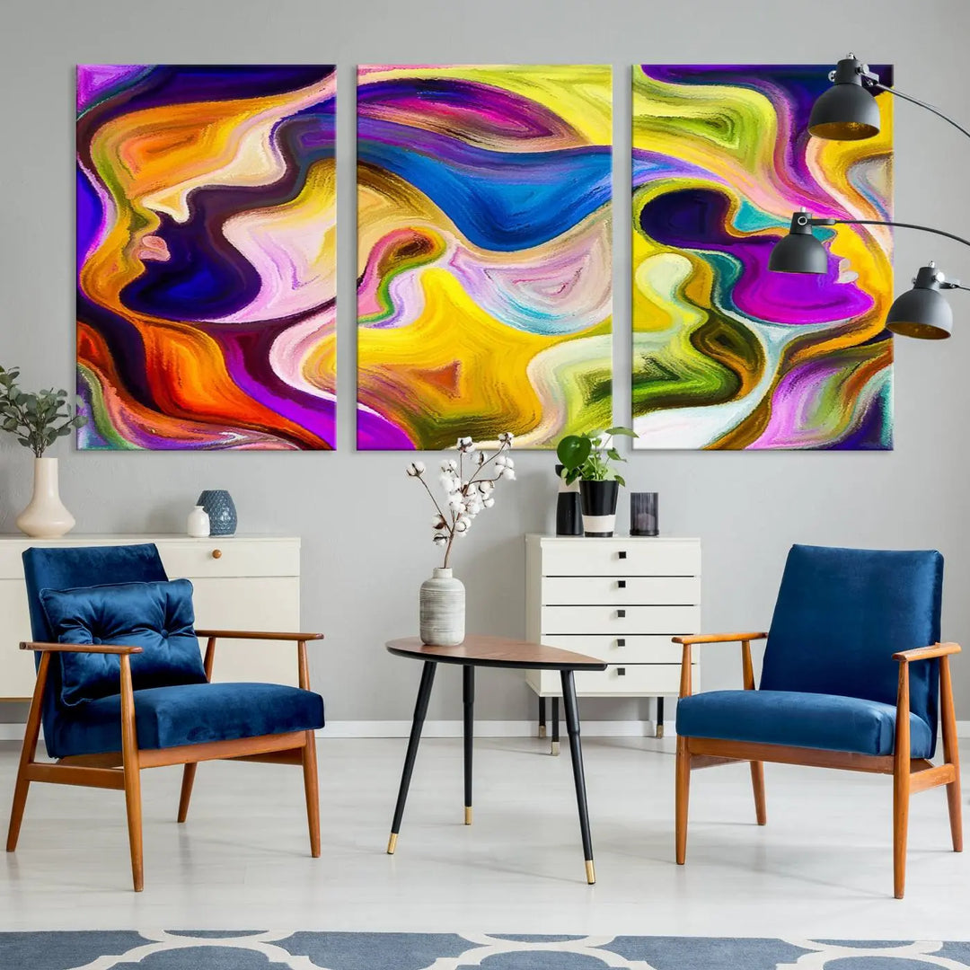 The wall above features the Vibrant Colors Human Figures Wall Art Canvas Print. Each piece showcases abstract multicolored face silhouettes on museum-quality canvas, enhancing both its vibrancy and longevity.