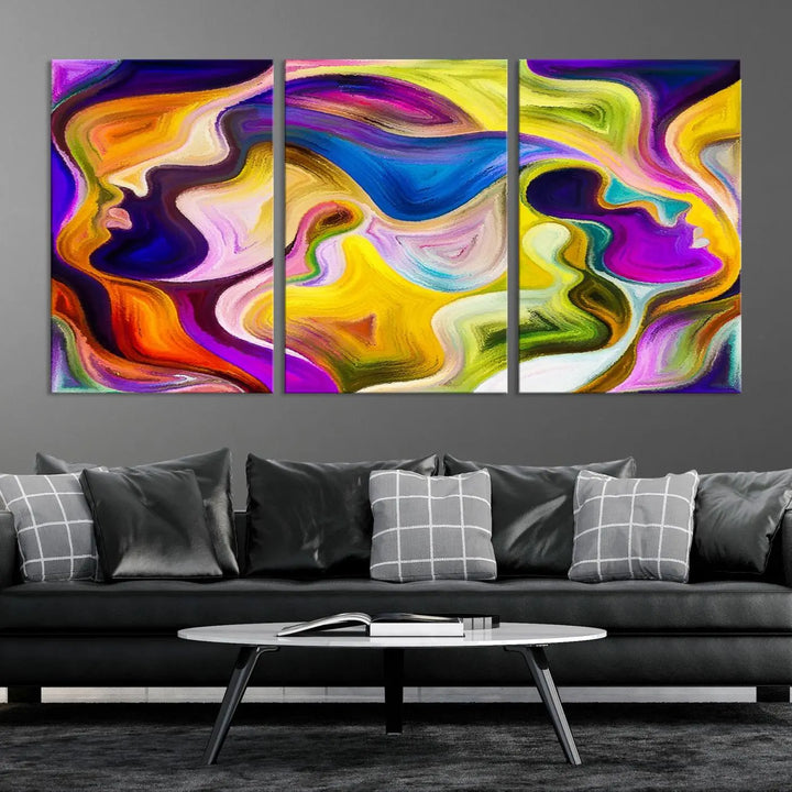 The wall above features the Vibrant Colors Human Figures Wall Art Canvas Print. Each piece showcases abstract multicolored face silhouettes on museum-quality canvas, enhancing both its vibrancy and longevity.