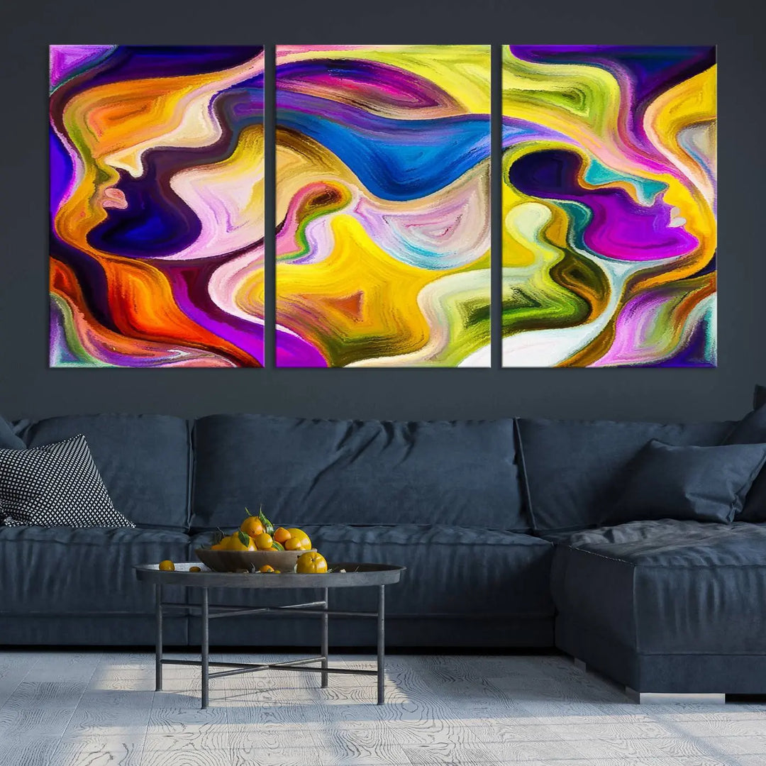 The wall above features the Vibrant Colors Human Figures Wall Art Canvas Print. Each piece showcases abstract multicolored face silhouettes on museum-quality canvas, enhancing both its vibrancy and longevity.