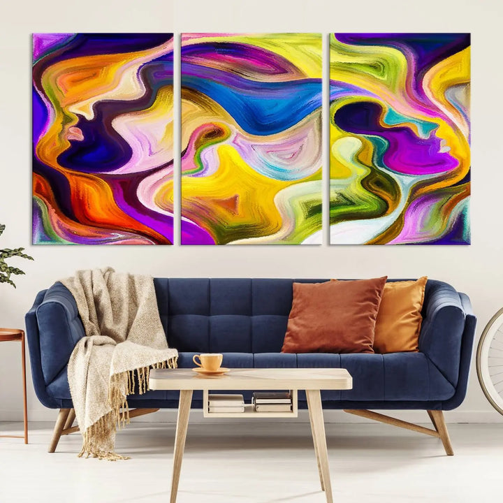 The wall above features the Vibrant Colors Human Figures Wall Art Canvas Print. Each piece showcases abstract multicolored face silhouettes on museum-quality canvas, enhancing both its vibrancy and longevity.