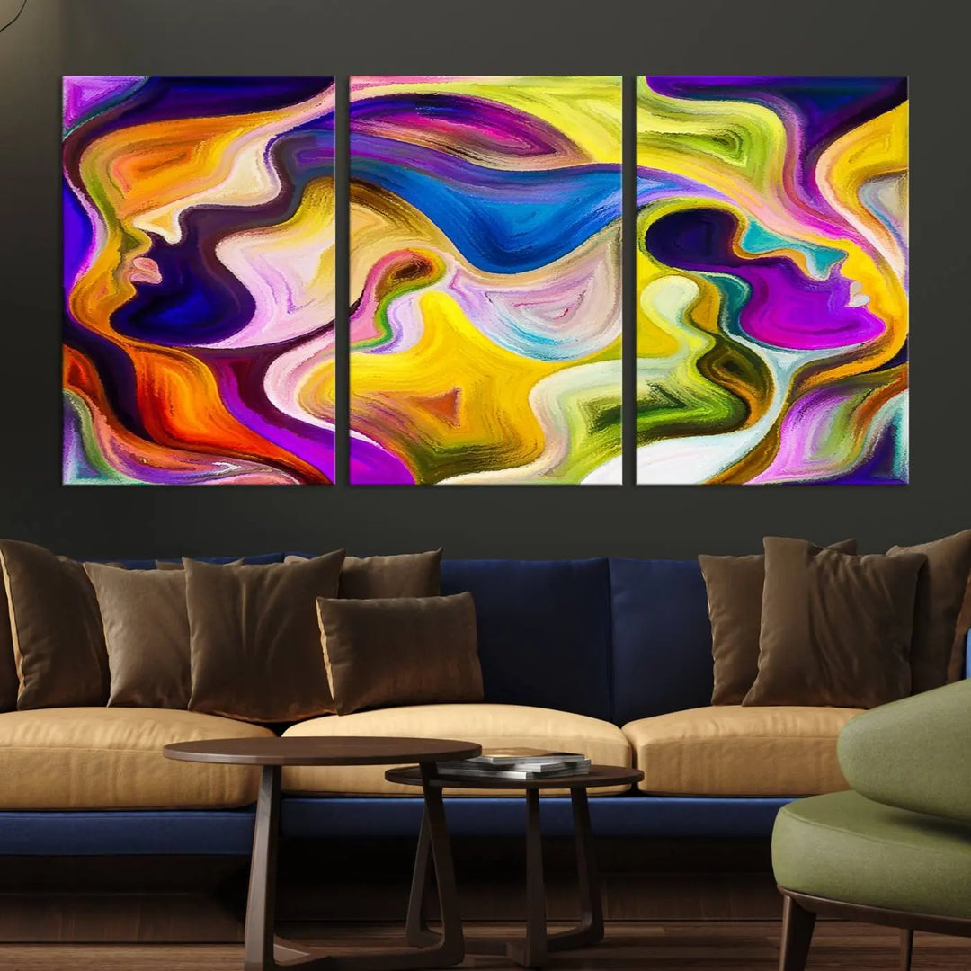 The wall above features the Vibrant Colors Human Figures Wall Art Canvas Print. Each piece showcases abstract multicolored face silhouettes on museum-quality canvas, enhancing both its vibrancy and longevity.