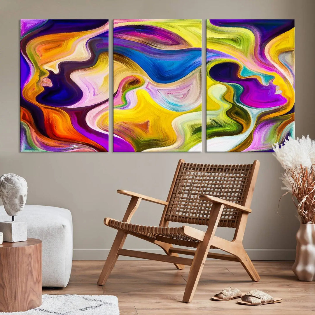 The wall above features the Vibrant Colors Human Figures Wall Art Canvas Print. Each piece showcases abstract multicolored face silhouettes on museum-quality canvas, enhancing both its vibrancy and longevity.