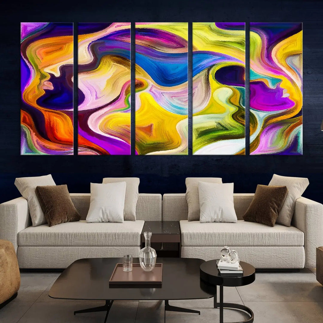 The wall above features the Vibrant Colors Human Figures Wall Art Canvas Print. Each piece showcases abstract multicolored face silhouettes on museum-quality canvas, enhancing both its vibrancy and longevity.