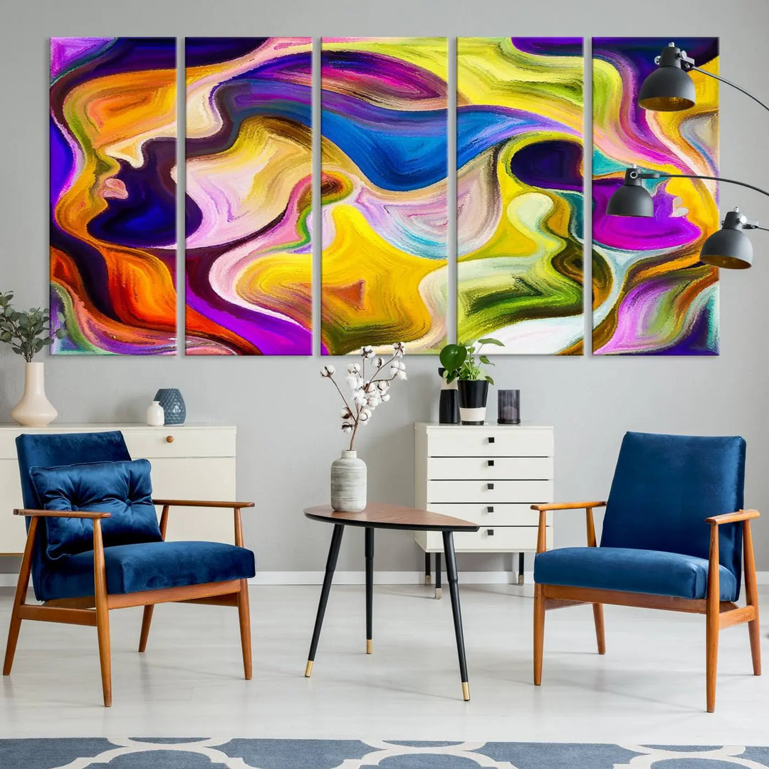 The wall above features the Vibrant Colors Human Figures Wall Art Canvas Print. Each piece showcases abstract multicolored face silhouettes on museum-quality canvas, enhancing both its vibrancy and longevity.