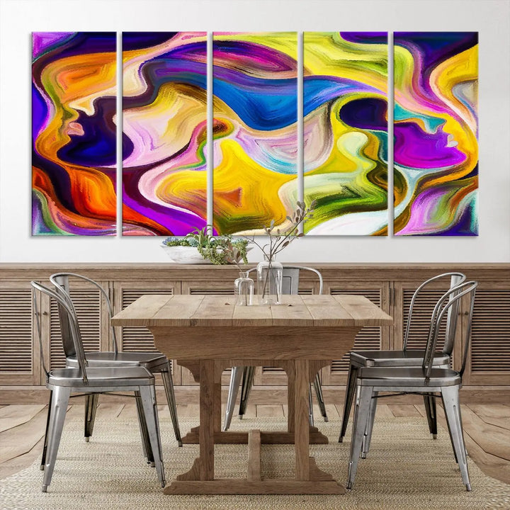 The wall above features the Vibrant Colors Human Figures Wall Art Canvas Print. Each piece showcases abstract multicolored face silhouettes on museum-quality canvas, enhancing both its vibrancy and longevity.