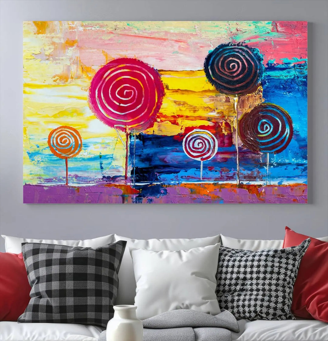 The Vibrant Lollipops Wall Art Canvas Print features a colorful abstract design of spiral trees set against a sunset background. This elegantly gallery-wrapped piece comes with a UV-protective coating, creating an impressive centerpiece in the room.