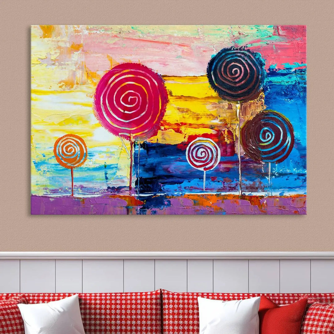 The Vibrant Lollipops Wall Art Canvas Print features a colorful abstract design of spiral trees set against a sunset background. This elegantly gallery-wrapped piece comes with a UV-protective coating, creating an impressive centerpiece in the room.