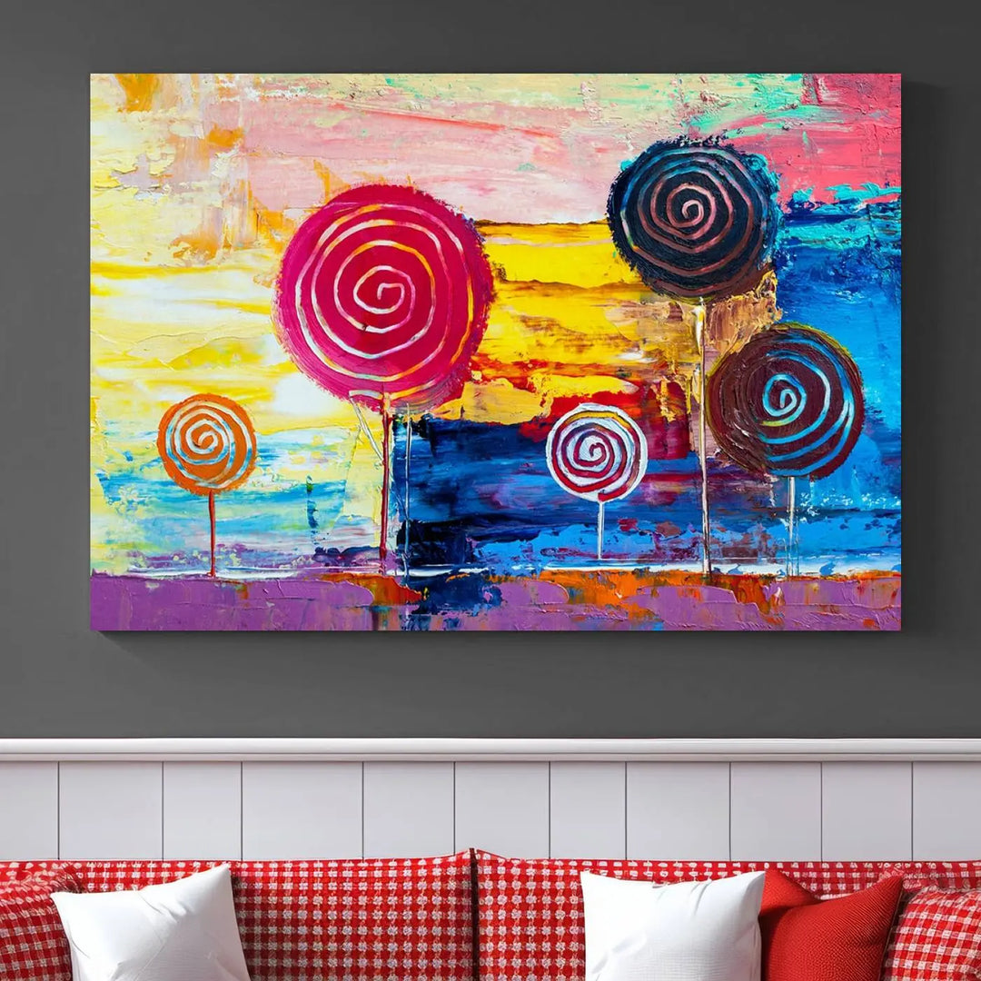 The Vibrant Lollipops Wall Art Canvas Print features a colorful abstract design of spiral trees set against a sunset background. This elegantly gallery-wrapped piece comes with a UV-protective coating, creating an impressive centerpiece in the room.