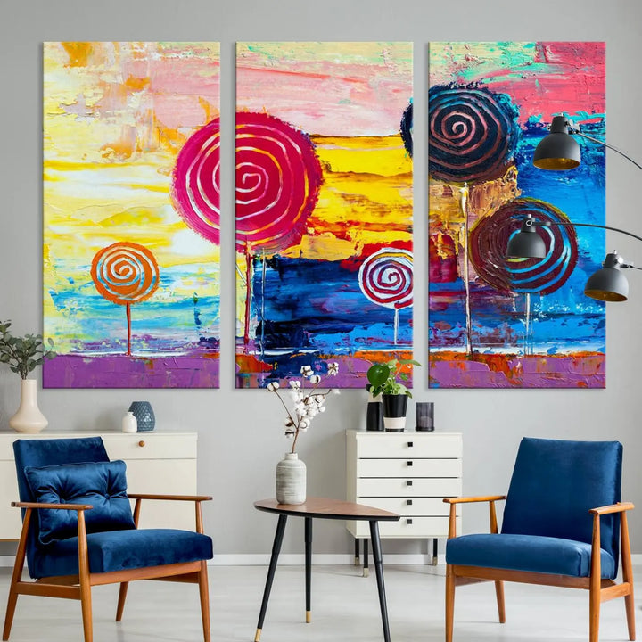 The Vibrant Lollipops Wall Art Canvas Print features a colorful abstract design of spiral trees set against a sunset background. This elegantly gallery-wrapped piece comes with a UV-protective coating, creating an impressive centerpiece in the room.