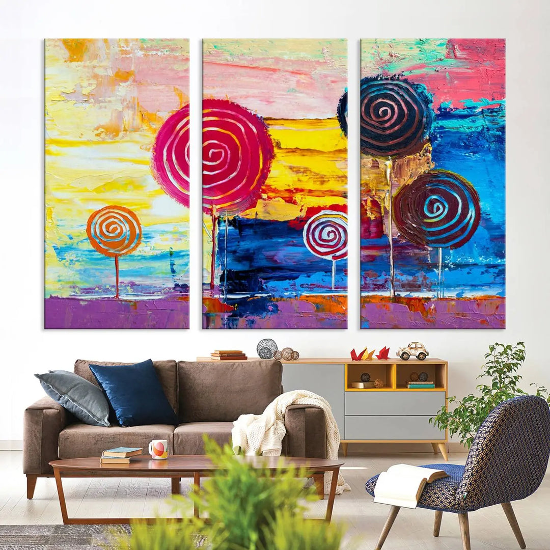 The Vibrant Lollipops Wall Art Canvas Print features a colorful abstract design of spiral trees set against a sunset background. This elegantly gallery-wrapped piece comes with a UV-protective coating, creating an impressive centerpiece in the room.