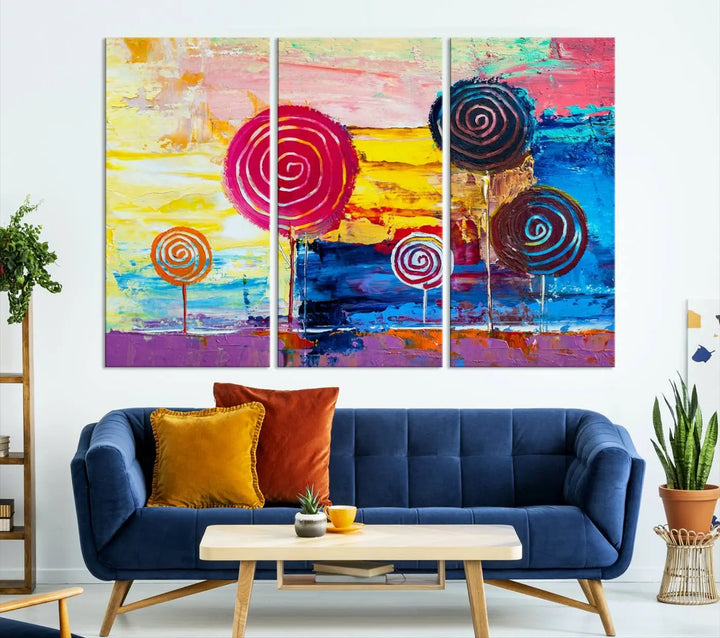 The Vibrant Lollipops Wall Art Canvas Print features a colorful abstract design of spiral trees set against a sunset background. This elegantly gallery-wrapped piece comes with a UV-protective coating, creating an impressive centerpiece in the room.