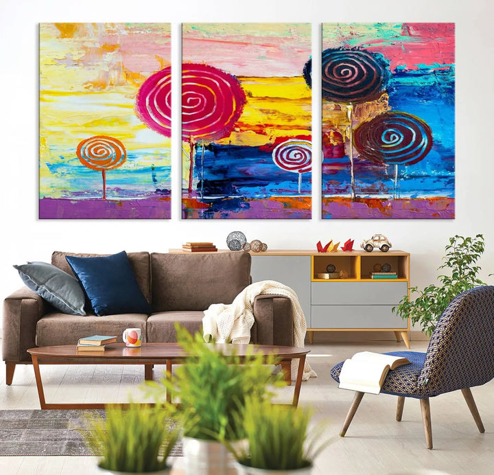 The Vibrant Lollipops Wall Art Canvas Print features a colorful abstract design of spiral trees set against a sunset background. This elegantly gallery-wrapped piece comes with a UV-protective coating, creating an impressive centerpiece in the room.