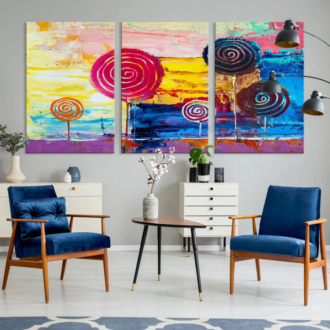 The Vibrant Lollipops Wall Art Canvas Print features a colorful abstract design of spiral trees set against a sunset background. This elegantly gallery-wrapped piece comes with a UV-protective coating, creating an impressive centerpiece in the room.