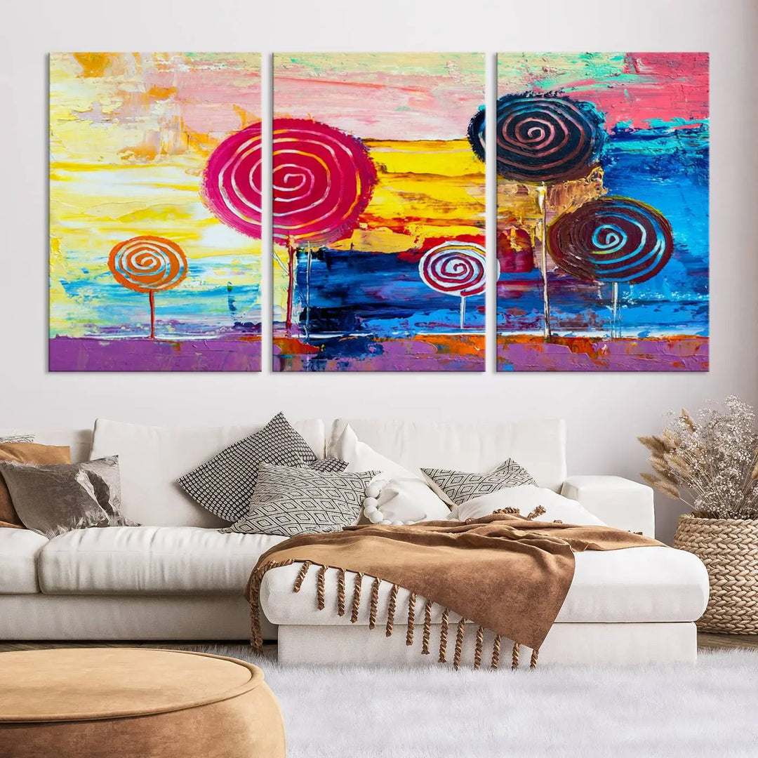 The Vibrant Lollipops Wall Art Canvas Print features a colorful abstract design of spiral trees set against a sunset background. This elegantly gallery-wrapped piece comes with a UV-protective coating, creating an impressive centerpiece in the room.