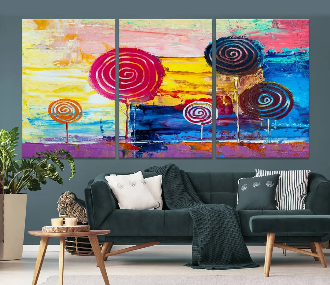 The Vibrant Lollipops Wall Art Canvas Print features a colorful abstract design of spiral trees set against a sunset background. This elegantly gallery-wrapped piece comes with a UV-protective coating, creating an impressive centerpiece in the room.