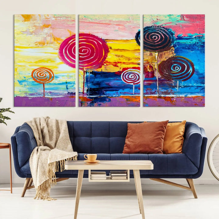 The Vibrant Lollipops Wall Art Canvas Print features a colorful abstract design of spiral trees set against a sunset background. This elegantly gallery-wrapped piece comes with a UV-protective coating, creating an impressive centerpiece in the room.