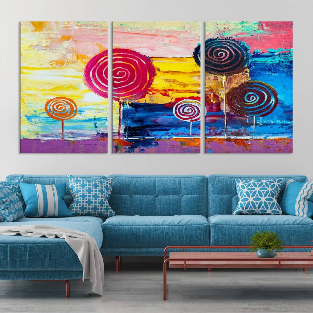 The Vibrant Lollipops Wall Art Canvas Print features a colorful abstract design of spiral trees set against a sunset background. This elegantly gallery-wrapped piece comes with a UV-protective coating, creating an impressive centerpiece in the room.