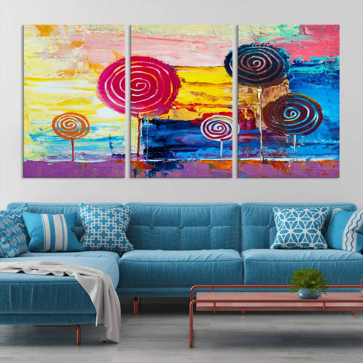 The Vibrant Lollipops Wall Art Canvas Print features a colorful abstract design of spiral trees set against a sunset background. This elegantly gallery-wrapped piece comes with a UV-protective coating, creating an impressive centerpiece in the room.