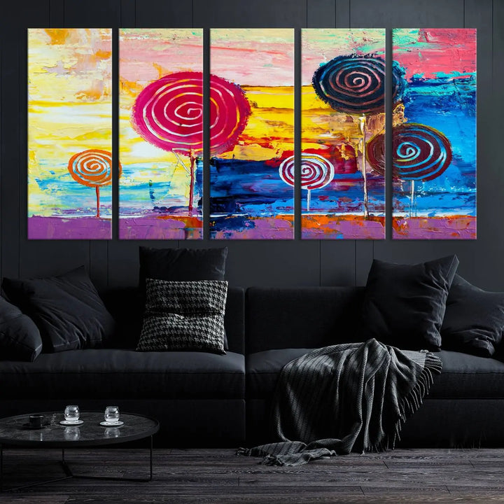 The Vibrant Lollipops Wall Art Canvas Print features a colorful abstract design of spiral trees set against a sunset background. This elegantly gallery-wrapped piece comes with a UV-protective coating, creating an impressive centerpiece in the room.