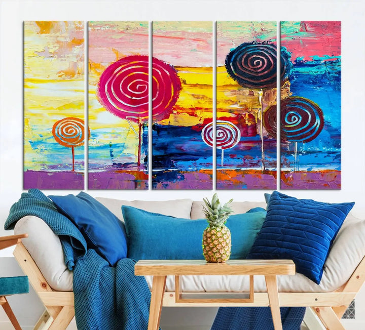 The Vibrant Lollipops Wall Art Canvas Print features a colorful abstract design of spiral trees set against a sunset background. This elegantly gallery-wrapped piece comes with a UV-protective coating, creating an impressive centerpiece in the room.