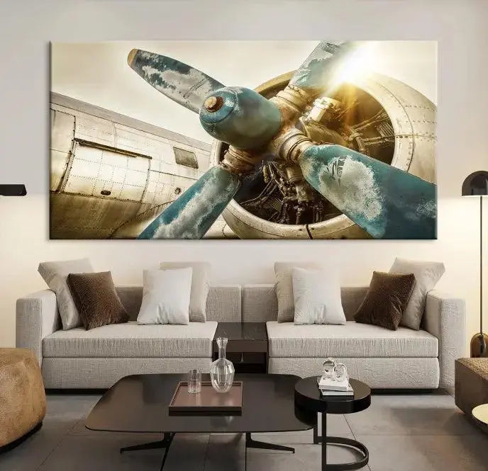 The Vintage Airplane Canvas Print, featuring a triptych design with an airplane propeller on museum-quality canvases with UV-protective coating, is displayed in a cozy living room.